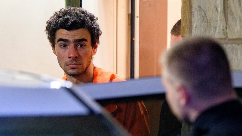 Suspected shooter Luigi Mangione is led from the Blair County Courthouse after an extradition hearing December 10, 2024 in Hollidaysburg, Pennsylvania.