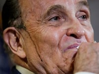 Former New York City Mayor Rudy Giuliani, personal attorney to U.S. President Donald Trump, wipes away sweat as he speaks about the 2020 U.S. presidential election results during a news conference in Washington, U.S., November 19, 2020.