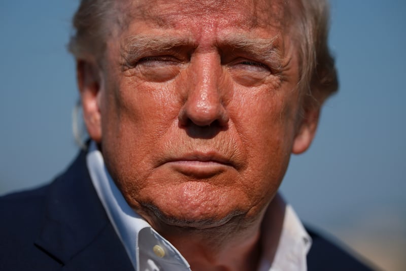 President Donald Trump stops to speak to members of the press as he walks to board Air Force One on October 27, 2026 at Joint Base Andrews, Maryland.