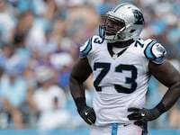 Michael Oher #73 of the Carolina Panthers watches a replay against the Minnesota Vikings in the 3rd quarter during their game at Bank of America Stadium.