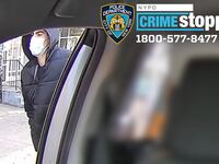 Suspect in the shooting of CEO Brian Thompson pictures wearing a mask and walking.
