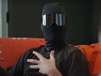 A masked man gesticulates in a still from 'Jerrod Carmichael Reality Show'