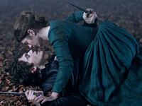 Emily Bader and Edward Bluemel on top of each other on the ground in ‘My Lady Jane’