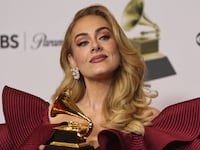 Adele poses with an award at the 65th Annual Grammy Awards