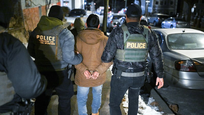 NEW YORK, NY - JANUARY 28: Law enforcement walk with Leonardo Fabian Cando Juntamay as he was detained in the Bronx during ICE led operations to apprehend illegal immigrants on Tuesday January 28, 2025 in New York, NY.