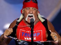 Professional wrestler Hulk Hogan rips his shirt as he speaks on stage on the fourth day of the Republican National Convention in Milwaukee.