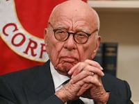 Rupert Murdoch looks as US President Donald Trump speaks to the press after signing an executive order to create a US sovereign wealth fund, in the Oval Office of the White House on February 3, 2025, in Washington, DC. (Photo by Jim WATSON / AFP) (Photo by JIM WATSON/AFP via Getty Images)
