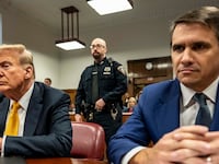Former U.S. President Donald Trump appears in court with attorneys Emil Bove (L) and Todd Blanche (R) for his trial for allegedly covering up hush money payments at Manhattan Criminal Court on May 21, 2024 in New York City.