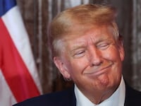 Donald Trump reacts during a campaign stop to unveil his leadership team, at the South Carolina State House in Columbia, South Carolina, Jan. 28, 2023.