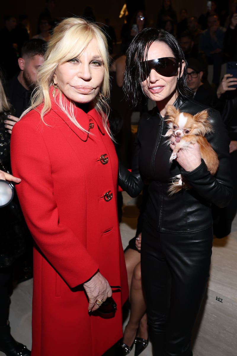 Donatella Versace and Demi Moore at the Gucci FW26 Fashion Show at Palazzo Delle Scintille in Milan, Italy, 2026.