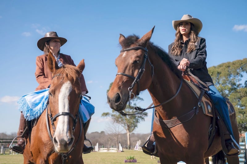 Homeland Security Kristi Noem rides a horse alongside Argentina's Security Minister Patricia Bullrich.