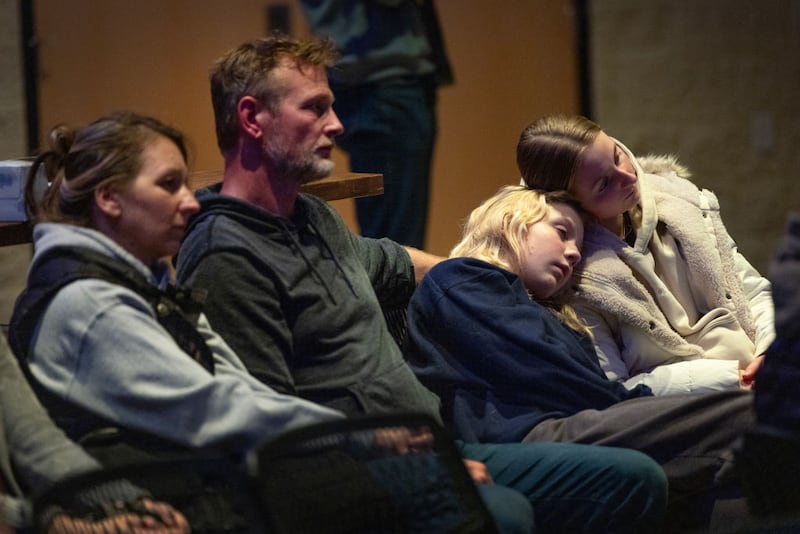 Families attend a prayer service to mourn the victims of Abundant Life Christian School in Madison, Wisconsin.