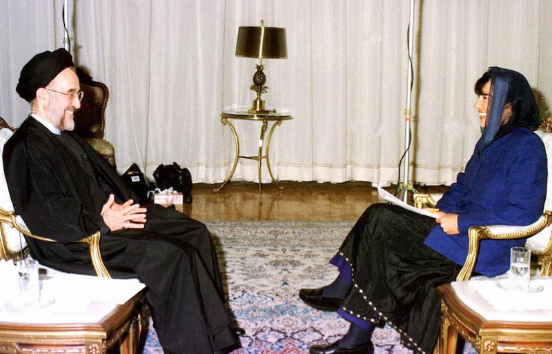 Tehran, IRAN: (FILES): This 06 January 1998 file photo shows then Iranian President Mohammad Khatami (L) with Iranian-born CNN correspondent Christianne Amanpour (R) prior to their interview in Tehran. The interview was the first of its kind by an Iranian leader since ties were broken between the US and Iran following the 1979 Islamic revolution. The US-based news channel CNN has been banned from working in Iran for having mistakenly quoted President Mahmoud Ahmadinejad as saying his country is seeking nuclear weapons, a government official told AFP 16 January 2006. During CNN's simultaneous translation of a press conference by Ahmadinejad 14 January 2006, the president was quoted as saying that "we believe all nations are allowed to have nuclear weapons" and that the West should not "deprive us to have nuclear weapons". AFP PHOTO/IRNA (Photo credit should read IRNA/AFP via Getty Images)