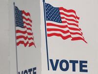 A voter casts her ballot at a polling station on Election Day in Falls Church, Virginia