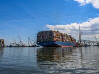 Crane barges surround the container ship Dali and the wreckage of the Francis Scott Key Bridge two weeks after the catastrophic collapse