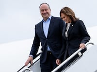 U.S. Vice President Kamala Harris and second gentleman Douglas Emhoff descend from Air Force Two at Delaware National Air Guard base in New Castle, Delaware, on July 22, 2024.