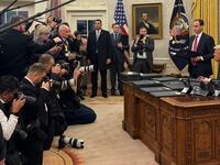 Donald Trump in Oval Office with reporters.