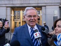 US Senator Bob Menendez (c), Democrat of New Jersey, speaks to members of the media outside the Manhattan Federal Court, in New York City following his arraignment on March 11, 2024.