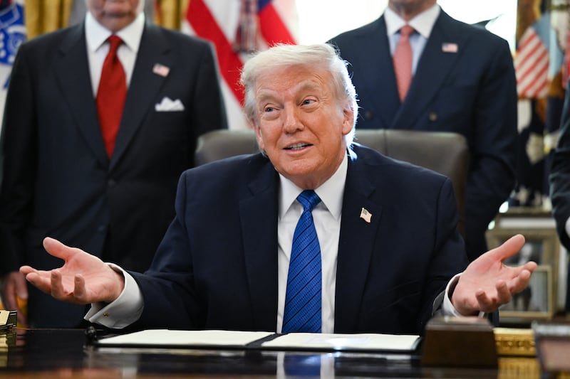 President Donald Trump speaks before signing executive orders in the Oval Office in the White House in Washington, DC, on January 30, 2026.