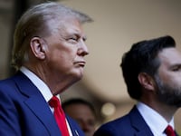 Donald Trump and J.D. Vance stand together.