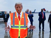 Donald Trump dresses in a garbage company’s high-visibility vest and speaks to the media at Green Bay Austin Straubel International Airport in Wisconsin.
