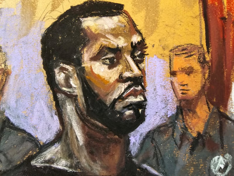 Sean "Diddy" Combs stands before U.S. Magistrate Judge Robyn Tarnofsky after prosecutors brought three criminal charges against him in federal court in the Manhattan borough of New York City, U.S., September 17, 2024 in this courtroom sketch.