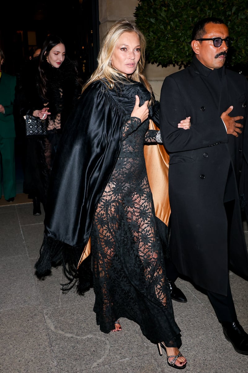 Kate Moss and Haider Ackermann leaving the Ritz Hotel in Paris to celebrate the supermodel's 50th birthday on January 16, 2024.