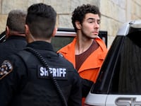 Luigi Mangione is led into the Blair County Courthouse for an extradition hearing Dec. 10, 2024 in Hollidaysburg, Pennsylvania.