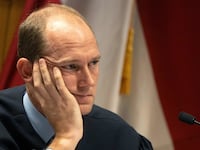 Judge Scott McAfee presides over a hearing for Harrison Floyd at the Fulton County Courthouse