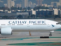 LOS ANGELES, CALIFORNIA - OCTOBER 17: A Cathay Pacific Boeing 777 airplane taxis at Los Angeles International Airport after arriving from Hong Kong on October 17, 2025 in Los Angeles, California.