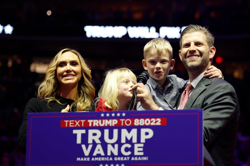 Lara and Eric Trump alongside their two children Luke and Carolina Trump.