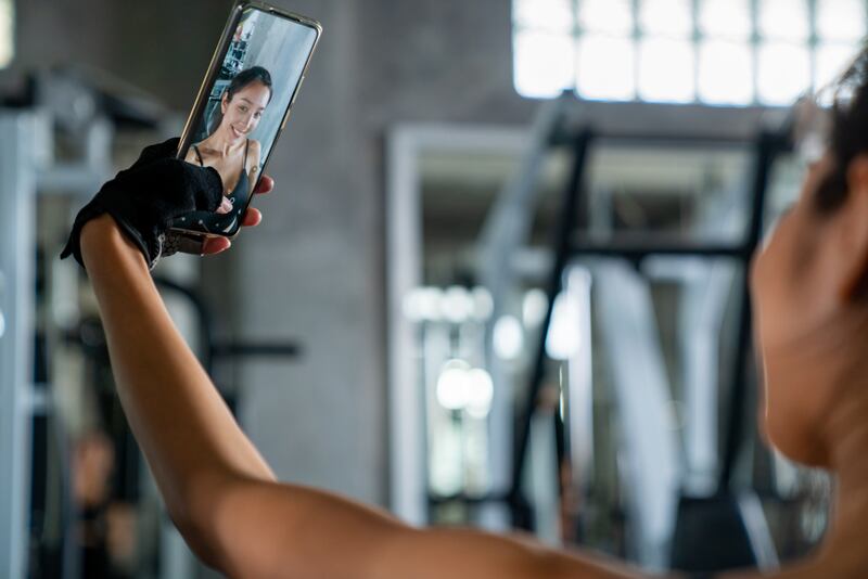 A woman poses to take a selfie.
