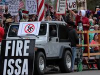 A protest against President Donald Trump and Rep. Darrell Issa (R-CA) outside Issa’s office in Vista, California, Oct. 31, 2017.