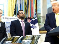 U.S. Attorney General Pam Bondi and Federal Bureau of Investigation Director Kash Patel look on as U.S. President Donald Trump speaks
