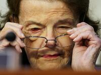 A picture of U.S. Senator Dianne Feinstein (D-CA) putting on her glasses during a Senate Judiciary Committee executive business meeting. Feinstein has reportedly been hospitalized after tripping and falling in her San Francisco home.