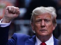 Former President Donald Trump gestures to his supporters, on the day of the closing arguments in the Trump Organization civil fraud trial