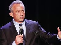 Robert F. Kennedy Jr. holding a microphone.