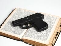 articles/2013/02/18/praying-while-packing-heat-and-other-unwieldy-american-traditions/130217-guns-church-schwartz-tease_ksz70g