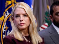 Attorney General Pam Bondi and FBI Director Kash Patel (R) appear during a news conference