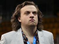 Hans Niemann stares forward at a chess tournament in Kazakhstan in 2022.