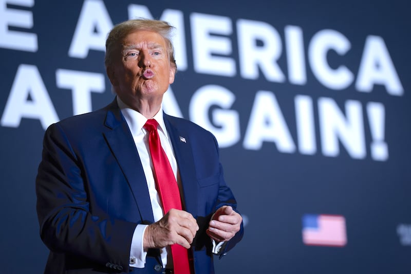 Donald Trump blows a kiss to a member of the audience during a Get Out The Vote rally at the North Charleston Convention Center on February 14, 2024 in North Charleston, South Carolina.