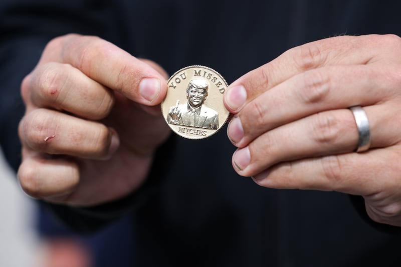 DeSantis showed off the coin he gifted Trump upon his arrival in Fort Myers on Friday.