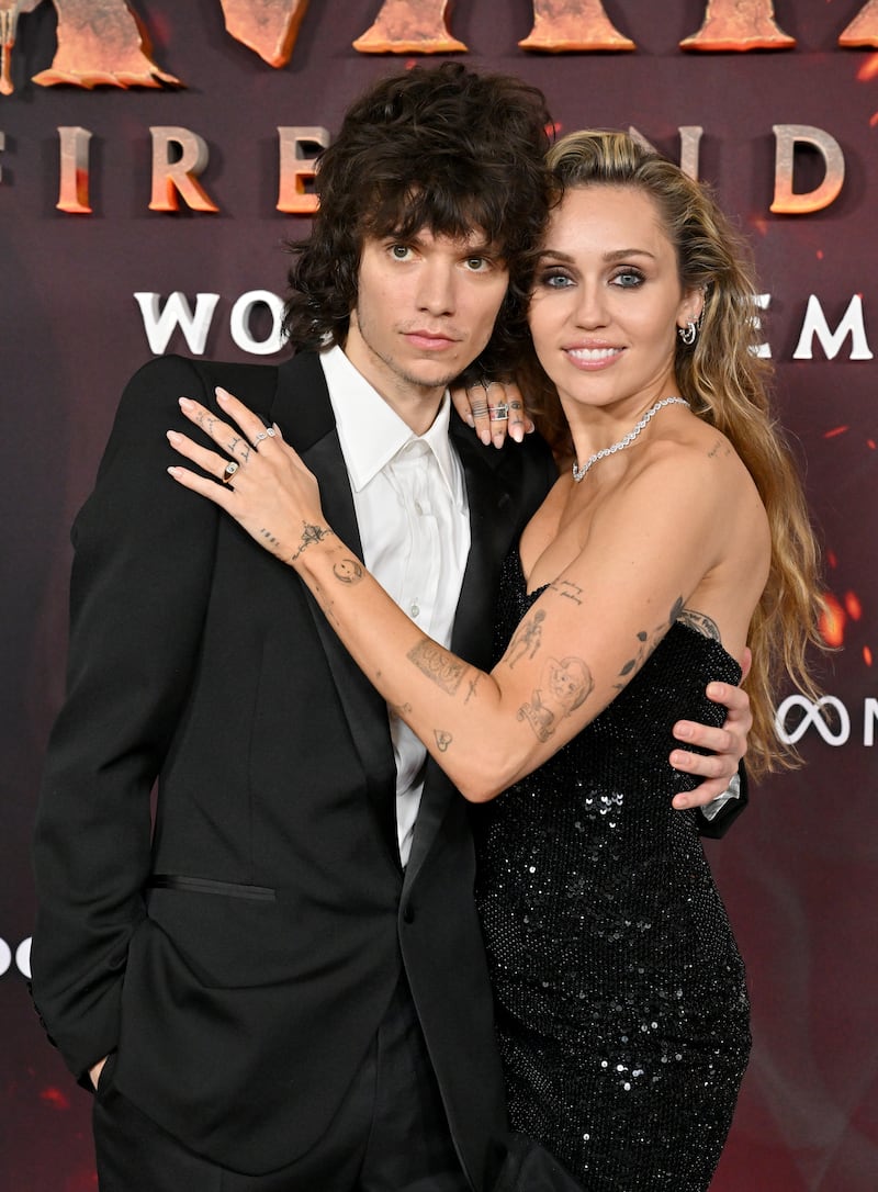HOLLYWOOD, CALIFORNIA - DECEMBER 01: Maxx Morando and Miley Cyrus attend the Global Premiere of 20th Century Studios' "Avatar: Fire and Ash" at Dolby Theatre on December 01, 2025 in Hollywood, California. (Photo by Axelle/Bauer-Griffin/FilmMagic)