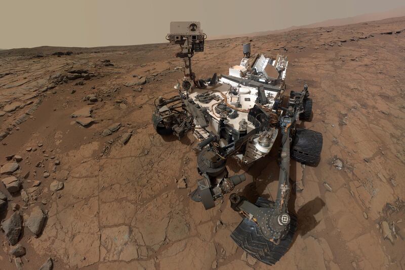 articles/2013/03/23/martians-how-recent-discoveries-raise-that-possibility/130320-mud-on-mars-krauss-tease_jscerl