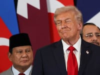 US President Donald Trump greets Indonesia's President Prabowo Subianto during a summit on Gaza in Sharm el-Sheikh on October 13, 2025. Trump landed in Egypt on October 13 for a summit on Gaza, following a lightning visit to Israel after a ceasefire he brokered entered into force.