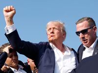 BUTLER, PENNSYLVANIA - JULY 13: Republican presidential candidate former President Donald Trump is rushed offstage during a rally on July 13, 2024 in Butler, Pennsylvania. Butler County district attorney Richard Goldinger said the shooter is dead after injuring former U.S. President Donald Trump, killing one audience member and injuring another in the shooting. (Photo by Anna Moneymaker/Getty Images)