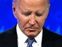 U.S. President Joe Biden looks down as he participates in the first presidential debate
