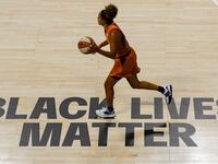 A Black Lives Matter sign painted on the floor at Feld Entertainment Center in Palmetto, Florida, in 2020.