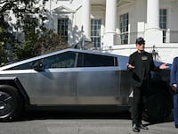 Elon Musk and Donald Trump in front of a Cybertruck