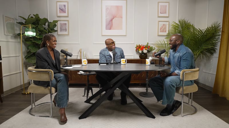 Michelle Obama paired her gray blazer with relaxed jeans and opted for brown open-toe heels. Here with Craig Robinson and Mahershala Ali.